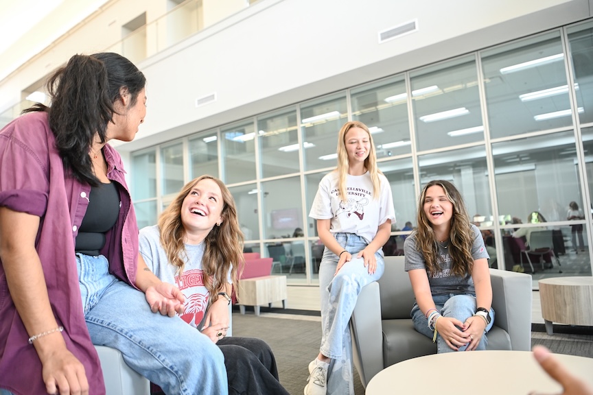 CU Windsor students reviewing coursework together